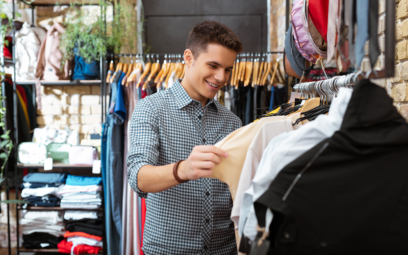 Man shopping for apparel to build a surf wardrobe.